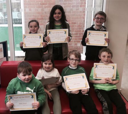 Our green themed Pupil of the Week winners - Ronan, Olivia, Fionn, Aaron, Andrew, Zara and Abi!